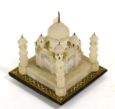 Lot 243 - A 19th Century Indian alabaster hardstone carving of the Taj Mahal, on painted square base