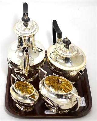 Lot 269 - An Art Nouveau silver four piece tea set by Walker & Hall, Sheffield