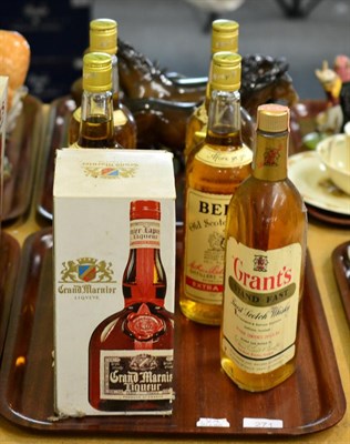 Lot 271 - Five bottles of assorted blended whisky (Bells and Grants) and a bottle of Grand Marnier