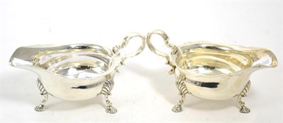 Lot 278 - A silver sauce boat with scalloped edge and another similar (2)