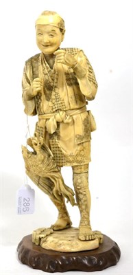 Lot 286 - A Japanese ivory okimono of a farmer