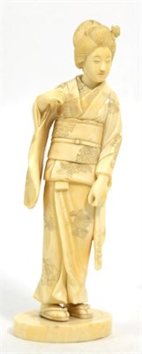 Lot 287 - A Japanese ivory okimono of a girl