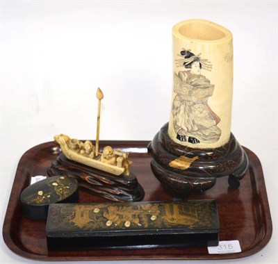 Lot 315 - A Japanese Meiji period carved ivory sleeve vase decorated with a geisha and a tree on a...