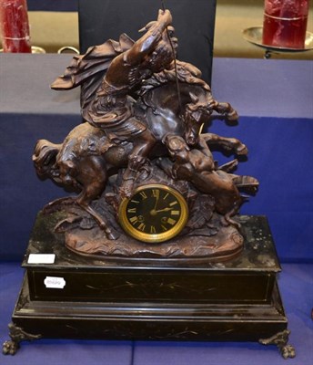 Lot 337 - A slate and patinated metal figural striking mantel clock surmounted by a warrior on horseback...