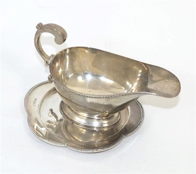 Lot 349 - A Harrods of London silver dish, together with a Walker and Hall silver sauce boat