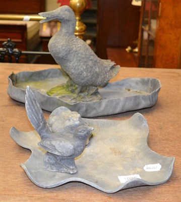 Lot 1026 - A small lead bird and frog on a lily pad shaped base together with a lead duck on a pond shaped...