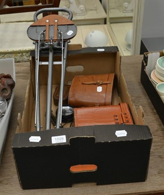 Lot 1028 - Two pairs of racing binoculars, cased; shooting stick; marching compass,cased; tap reseating...