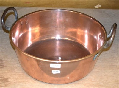 Lot 1039 - A copper two handled large jam pan