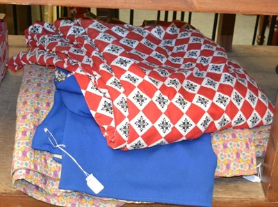 Lot 1041 - A red and white printed cotton bed cover, another smaller, and a patterned quilt (3)