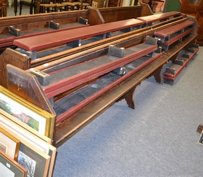 Lot 1051 - Two pine church pews, together with six padded kneeling benches