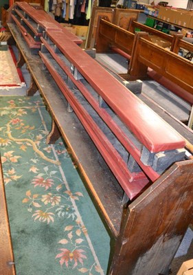 Lot 1052 - A pair of pine church pews, together with eight padded kneeling benches