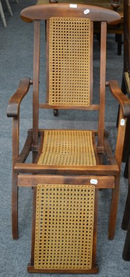 Lot 1056 - A 20th century bergere folding beech chair