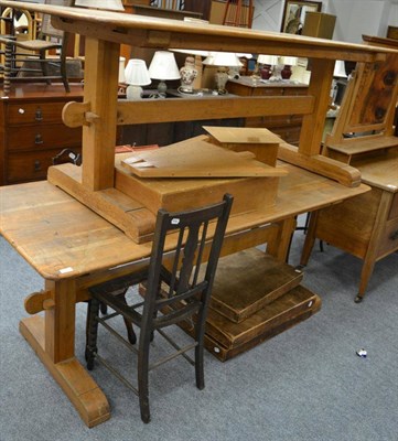 Lot 1064 - Two trestle based refectory tables, a spinning chair, an occasional chair, three folding...