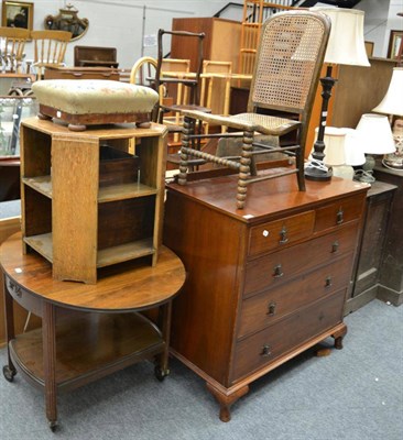 Lot 1065 - A four height chest of drawers, a cane work chair, a drop leaf trolley, an oak occasional table and