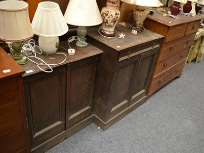 Lot 1067 - A four height chest of drawers, and two panelled cabinets