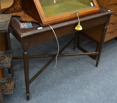 Lot 1079 - A 19th/early 20th century leather inset mahogany writing table