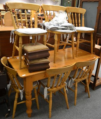 Lot 1084 - A pine farmhouse kitchen table, together with six pine chairs, an occasional chair, two...