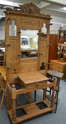 Lot 1085 - A Victorian oak carved hall stand