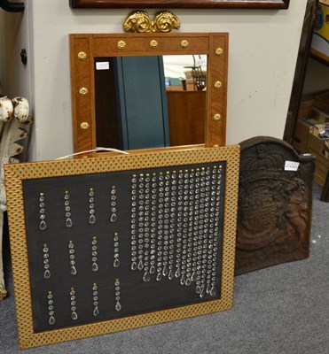 Lot 1090 - A rectangular wall mirror with rams head and a gilt framed panel with faceted drops