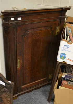 Lot 1091 - A George III oak wall hanging corner cupboard