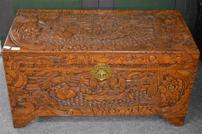 Lot 1092 - A Chinese carved camphor wood chest with lock