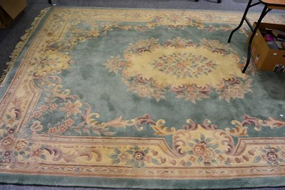 Lot 1206 - A green ground Chinese rug