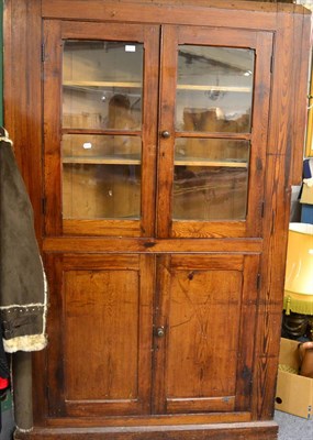 Lot 1207 - A Victorian pitch pine corner cupboard unit