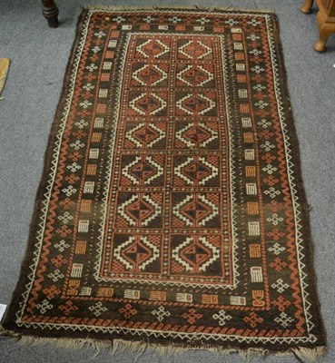 Lot 1222 - Turkmen rug, North Afghanistan, the crimson field with three elephant foot güls enclosed by...