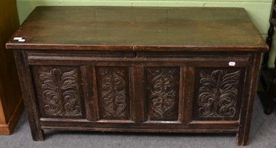 Lot 1224 - An 18th century and later carved oak coffer