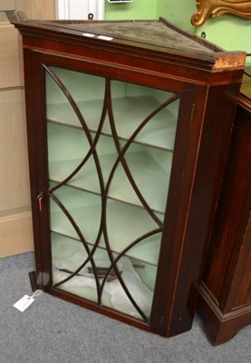 Lot 1229 - Early 19th century mahogany corner cupboard, with astragal glazed doors