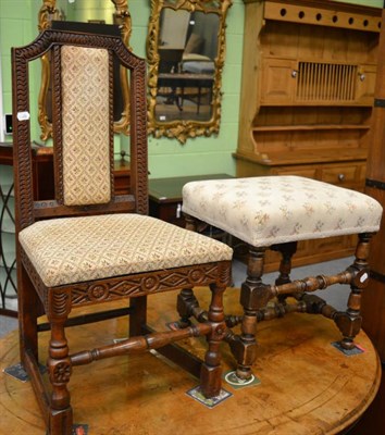 Lot 1230 - A turned beech stool and a carved oak chair (2)