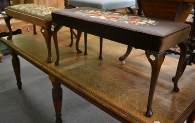 Lot 1232 - An oak square stool with tapestry mount and two similar long footstools (3)