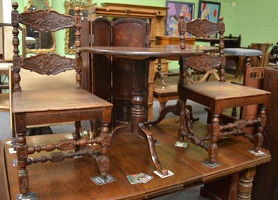 Lot 1238 - A pair of carved oak hall chairs