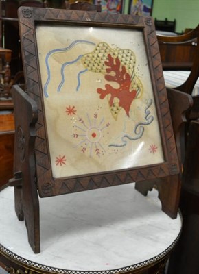 Lot 1247 - Ladybird man carved oak adjustable table/firescreen