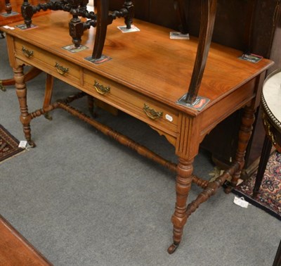 Lot 1250 - A late Victorian mahogany side table, fitted with two drawers, stamped JAS Scholbred & Co