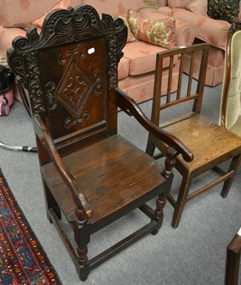 Lot 1269 - An 18th century carved oak armchair