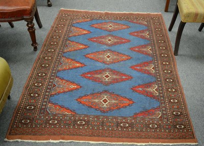 Lot 1277 - A Dofemalti rug, West Anatolia, the indigo lozenge field with central hooked medallions, framed...