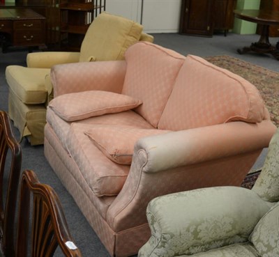 Lot 1286 - A two seater sofa, upholstered in salmon pink and a single chair upholstered in lemon (2)