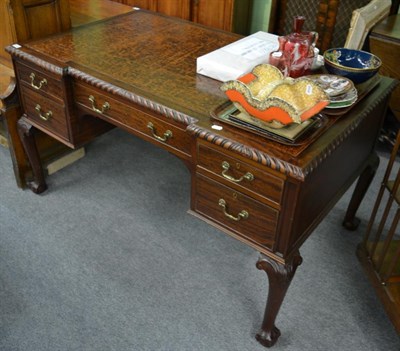 Lot 1288 - A mahogany inverted breakfront desk