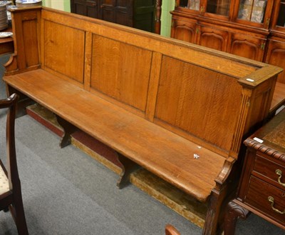 Lot 1289 - A oak panel back settle