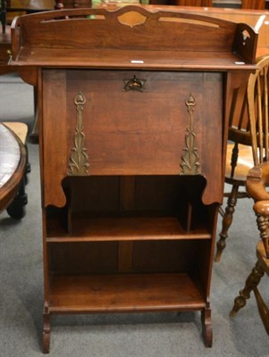 Lot 1294 - An early 20th Century Art Nouveau influence student's desk with fall-flap, approx. 100cm in height