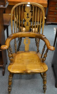 Lot 1295 - A set of four reproduction high back Windsor chairs