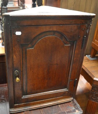 Lot 1314 - An 18th Century oak wall-hanging corner cupboard, 75cm in height