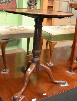 Lot 1321 - A Georgian mahogany tripod table with shell inlay