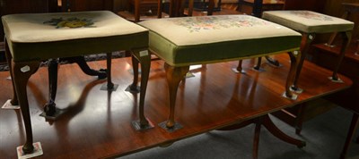 Lot 1326 - Three stools similarly upholstered with floral tapestry mounts