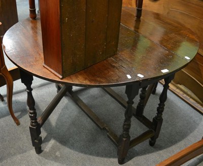 Lot 1329 - A William and Mary oak gateleg dining table, 113cm in width