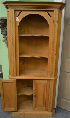 Lot 1330 - A pine corner cupboard