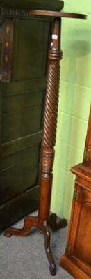 Lot 1343 - A Georgian style mahogany torchere stand, wrythen column, tripod base