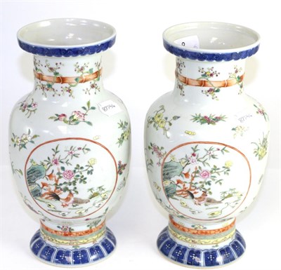 Lot 8 - A pair of Chinese Wucai style porcelain vases
