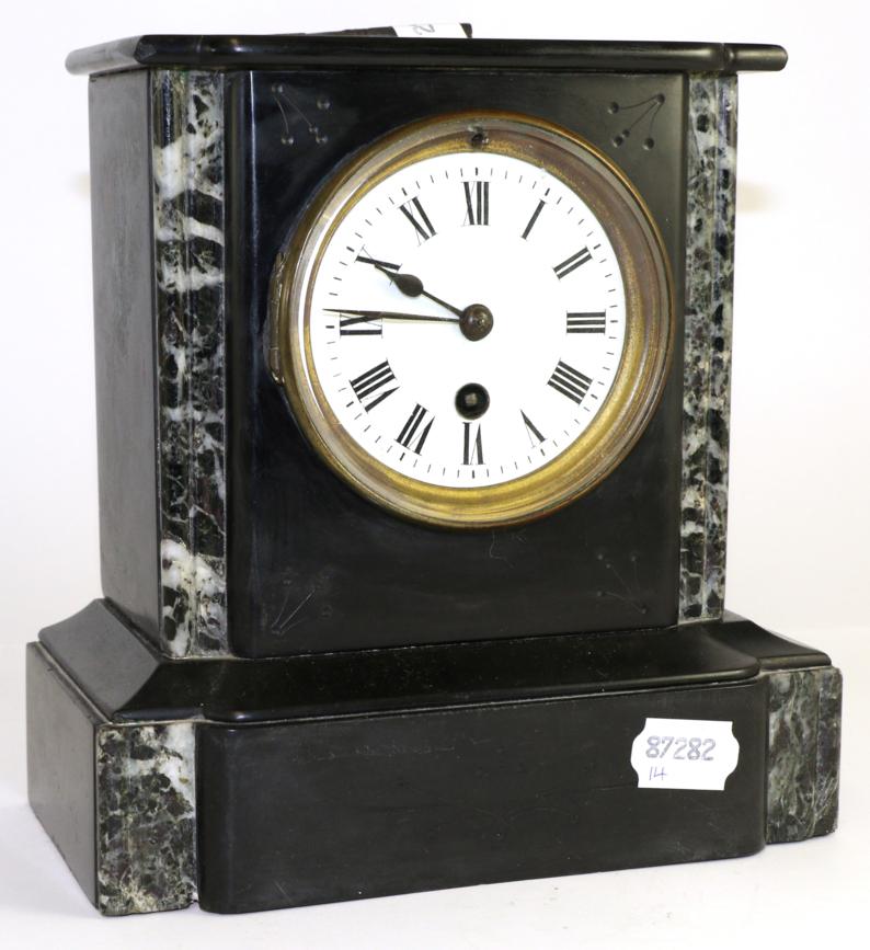 Lot 10 - A black marble mantel time piece